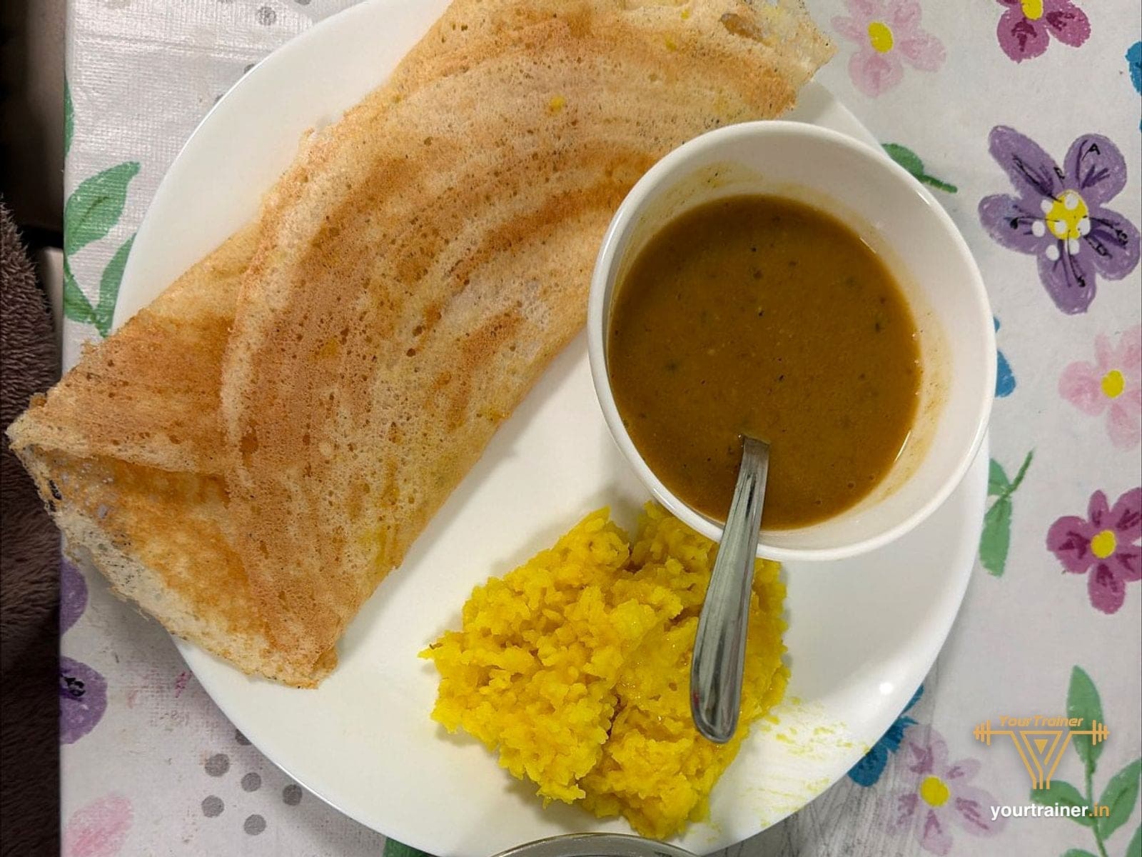 Dosa with sambar, a side dish and radish sticks
