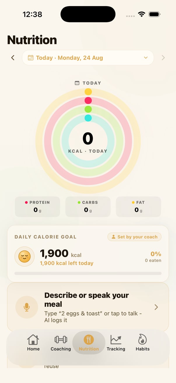 The nutrition dashboard in YourTrainer Go showing calorie rings, protein carbs and fat, and a daily calorie goal set by the coach
